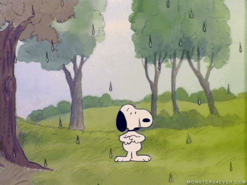 a cartoon of snoopy standing under a tree in a field