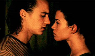 a man and a woman are kissing each other