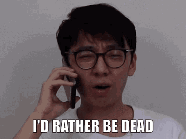 a man wearing glasses is talking on a cell phone and has the words i 'd rather be dead below him