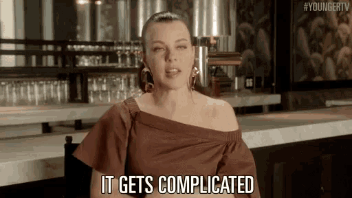 a woman is sitting at a bar with her eyes closed and says it gets complicated .