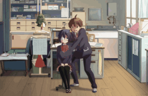 a boy and a girl are standing in a room