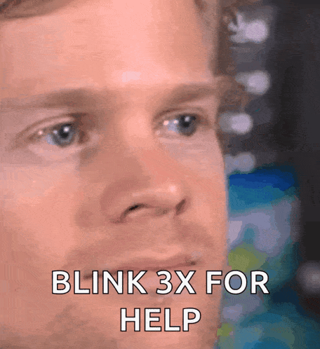 a close up of a man 's face with the words blink 3x for help on it