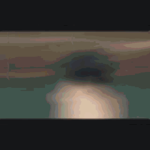 a blurred image of a person 's face in the dark