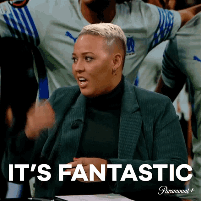 a woman says it 's fantastic in front of a crowd
