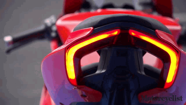 a red motorcycle with the words motorcyclist on the bottom right