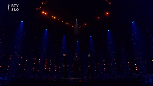 a group of people on a stage with the words rtv slo in the corner