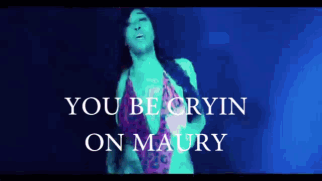 a woman in a bathing suit is dancing with the words you be cryin on maury behind her