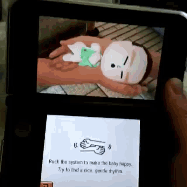 a person is playing a video game on a nintendo 3ds that says rock the system to make the baby happy