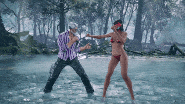 a man in a striped shirt is standing next to a woman in a red bikini