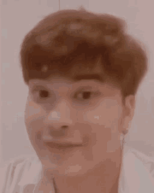 a close up of a person 's face with a funny face .