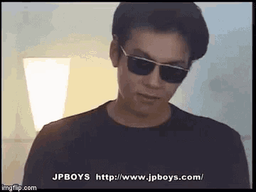 the man is wearing sunglasses and a black shirt .