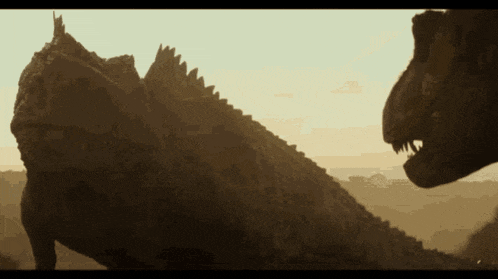 two dinosaurs are standing next to each other in a field