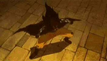 a person is standing on a brick floor with their shadow cast on the ground .