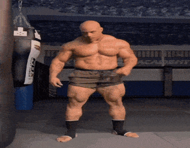 a muscular man stands in front of a punching bag that says academy