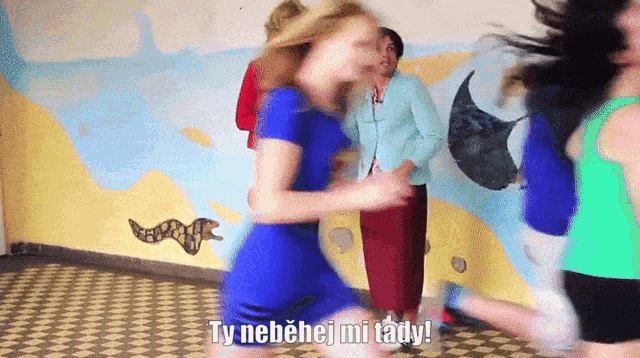 a woman in a blue dress is dancing with the words ty nebehej mi tady