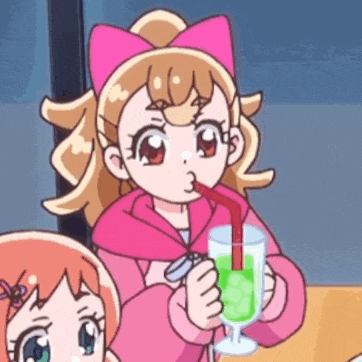 a girl with a pink bow on her head is drinking a green drink through a straw .