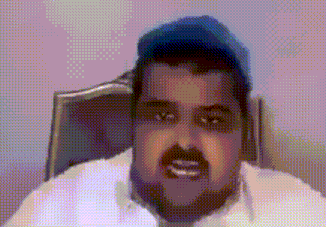 a man wearing a white shirt and a blue hat is sitting in a chair