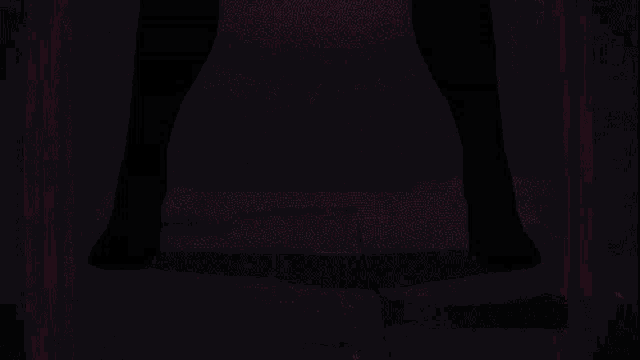 a close up of a person 's face with a pink light coming out of it