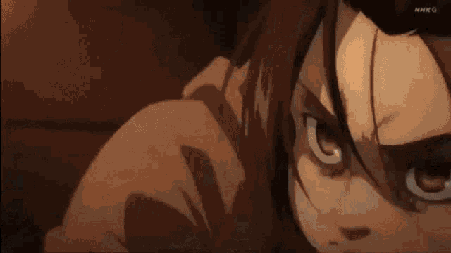 a close up of a person 's face with a very angry look on it .