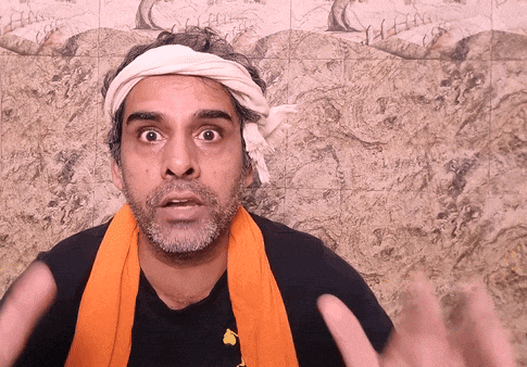 a man with a scarf around his neck and a headband on his head