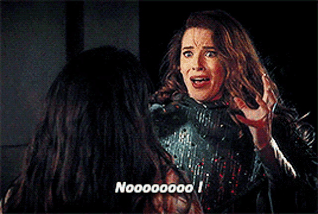 two women are talking to each other and one of them is saying no 000000 !