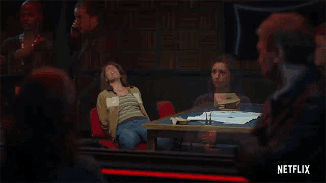 a netflix ad shows a woman sitting at a table with her eyes closed