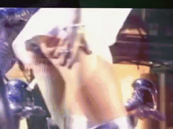 a blurred image of a person holding a gun in a video game