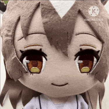 a close up of a stuffed animal that says kinemaster on the bottom right