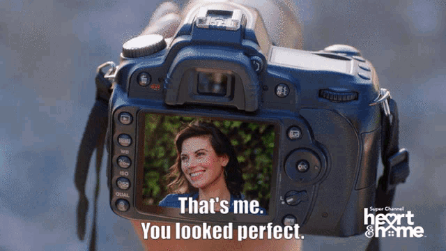 a person is holding a camera with the words that 's me you looked perfect