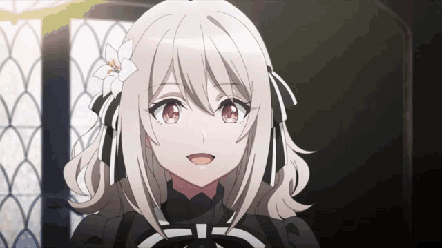 a girl with a white flower in her hair