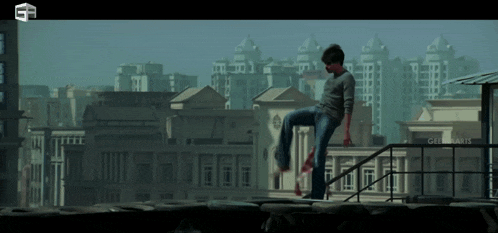 a man is standing on a railing in front of a building that says ' gm ' on it