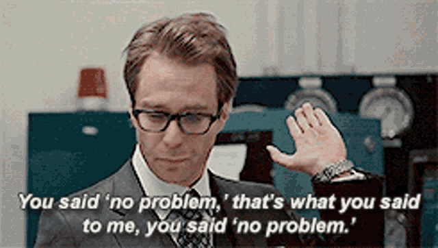 a man in a suit and tie is saying " you said no problem "