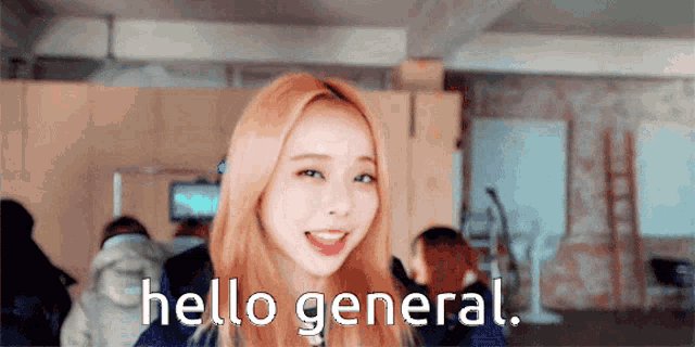 a girl is smiling and says hello general