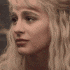 a close up of a woman 's face with blonde hair looking at the camera .