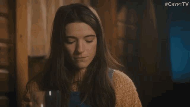 a woman with her eyes closed is smiling in a scene from crypttv