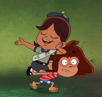 a girl scout is holding another girl on her back