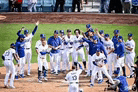 a baseball team is celebrating a win on the field .