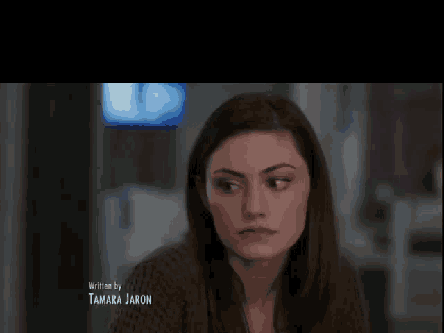 a close up of a woman 's face with the words written by tamara jaron below it