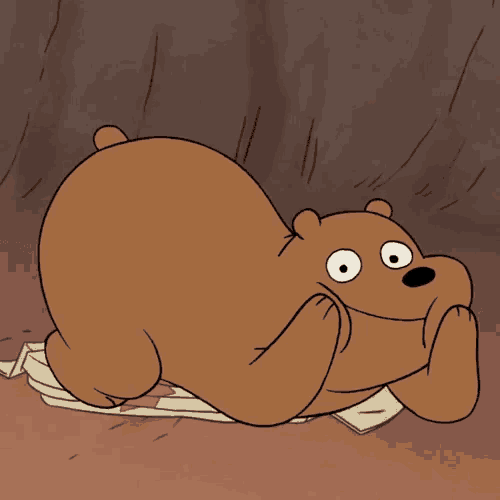 a cartoon bear is laying on a pile of paper