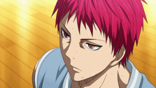 a close up of a person with red hair and orange eyes