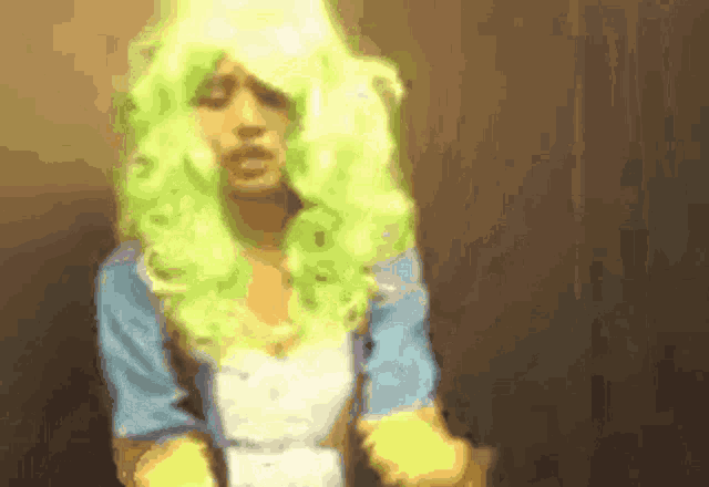 a woman in a green wig and blue jacket