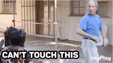 a man in a blue shirt is standing next to a woman with the words " can 't touch this " written below him