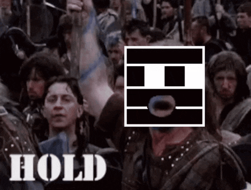 a group of people standing in a crowd with the word hold written on the bottom of the image .