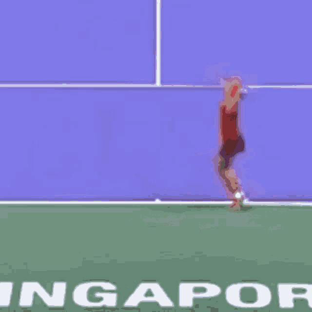 a tennis player on a court with the word ingapor in white letters