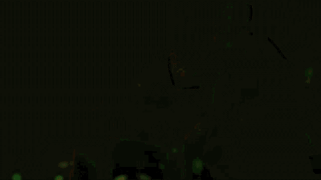 a dark background with a few spots of light in the middle