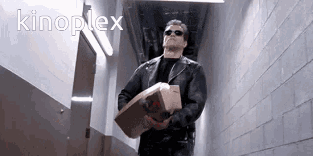 a man in a black leather jacket is carrying a bag of mcdonald 's chicken