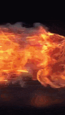 a fireball is flying through the air with a black background