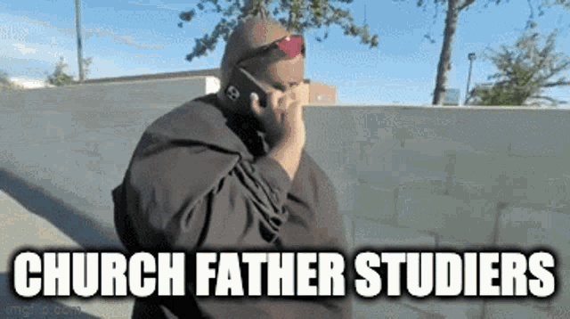 a man wearing sunglasses is talking on a cell phone and the caption says church father studiers