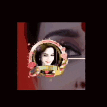 a picture of a woman 's face is surrounded by a floral frame