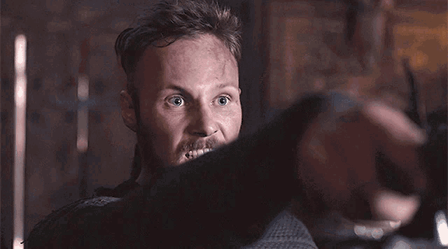 a man with a beard and a surprised expression on his face